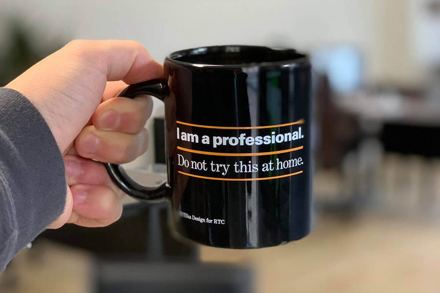 Get an Insurance Quote - Holding Up a Mug from the Office